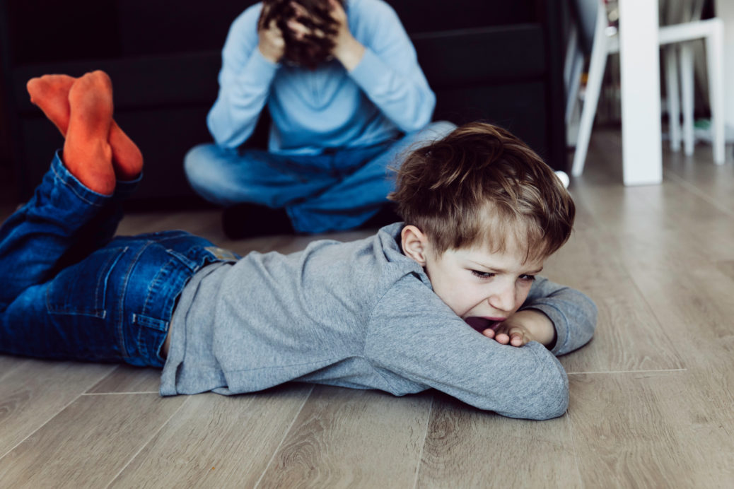Angry stressed child and tired father